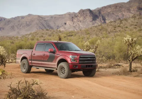 Ford F-150 four-wheel-drive truck on an Arizona desert trail.